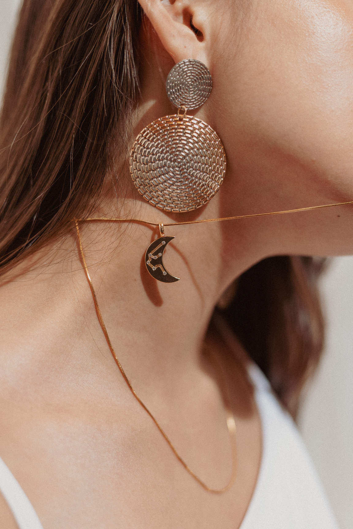 Woman in Earrings and Necklace